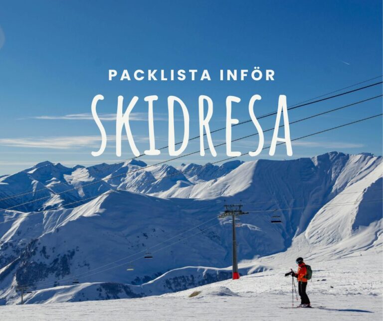 en bild flera berg täckta i snö, en person i full utrustning på skidor i backen